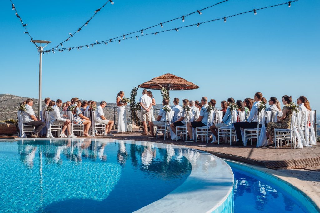 Civil Wedding Ceremony Cyprus, 40 guest ceremony, below a blue sky with a infinity swimming pool in Paphos Cyprus.