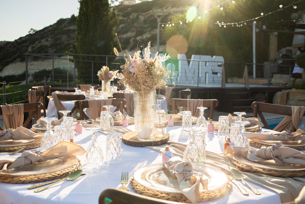 boho style wedding dinner reception with center pieces and dinner equipement